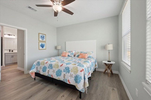 1326 Emerald Dr, Port Bolivar, TX 77650 - bedroom featuring light wood finished floors and ceiling fan
