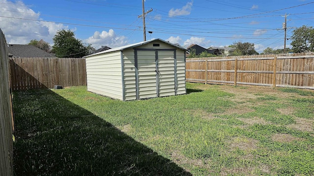 view of outbuilding featuring a lawn