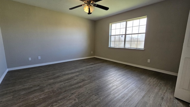 unfurnished room with ceiling fan and dark wood-type flooring