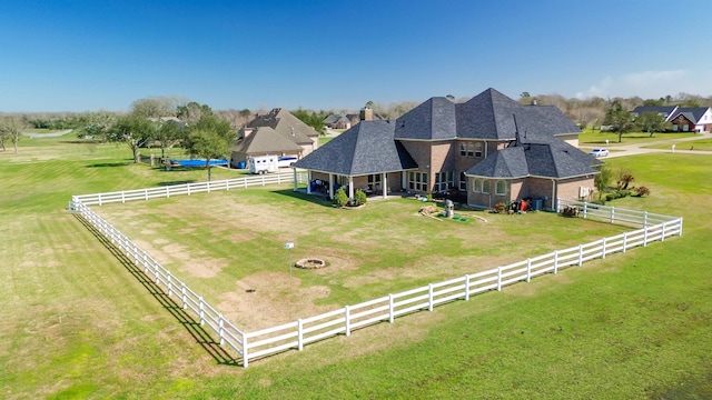 birds eye view of property featuring a rural view