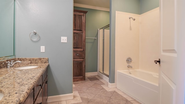 bathroom featuring vanity, baseboards, tile patterned floors, a bathtub, and a shower with door