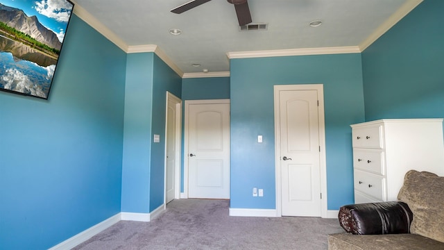 unfurnished room featuring ceiling fan, ornamental molding, and light carpet