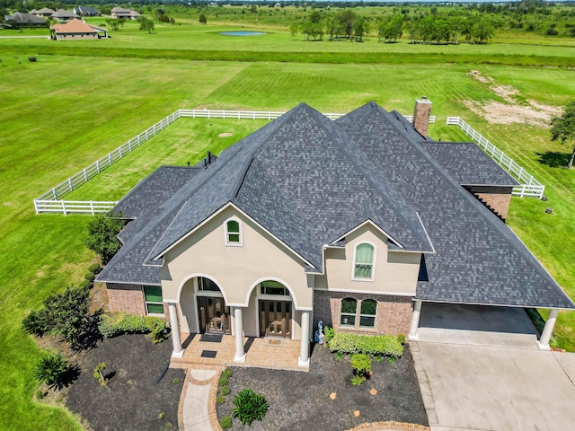 birds eye view of property featuring a rural view