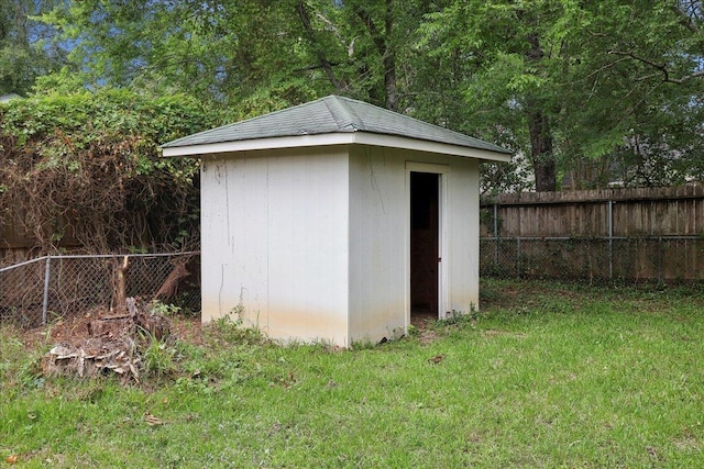 view of shed with a fenced backyard