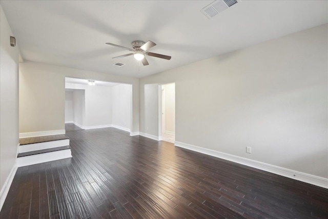 spare room with baseboards, a ceiling fan, and visible vents