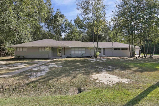 ranch-style home with a front yard