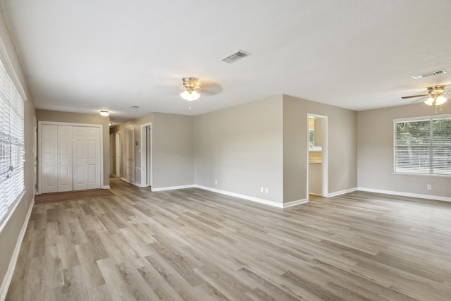 spare room with ceiling fan and light hardwood / wood-style floors