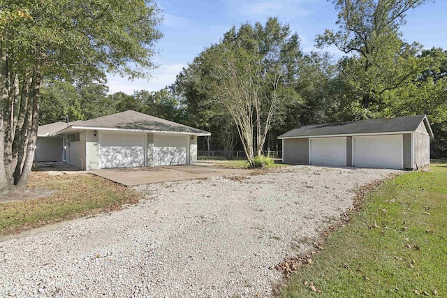 view of front of house featuring an outbuilding and a garage