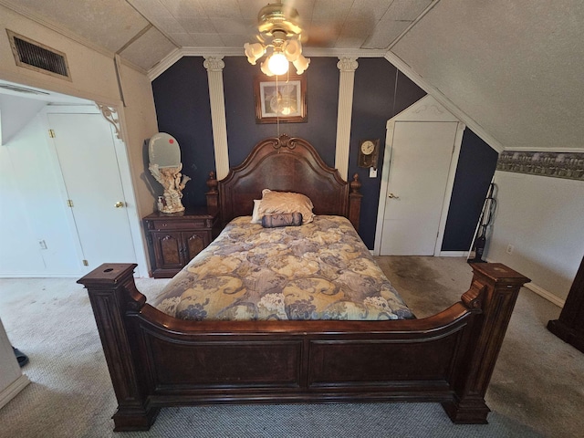 bedroom featuring carpet, decorative columns, ornamental molding, ceiling fan, and lofted ceiling