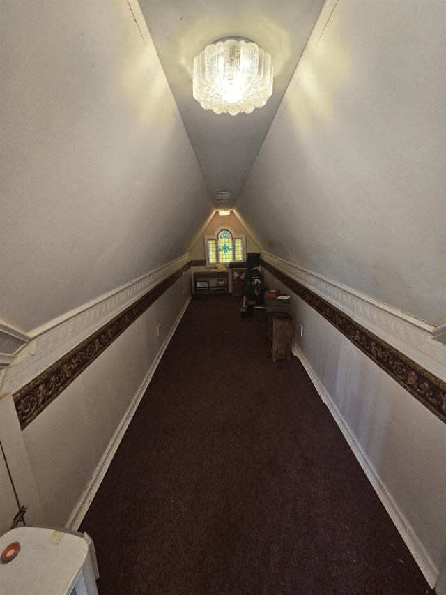 additional living space featuring carpet flooring and vaulted ceiling