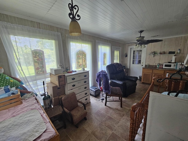 bedroom with crown molding and wood ceiling