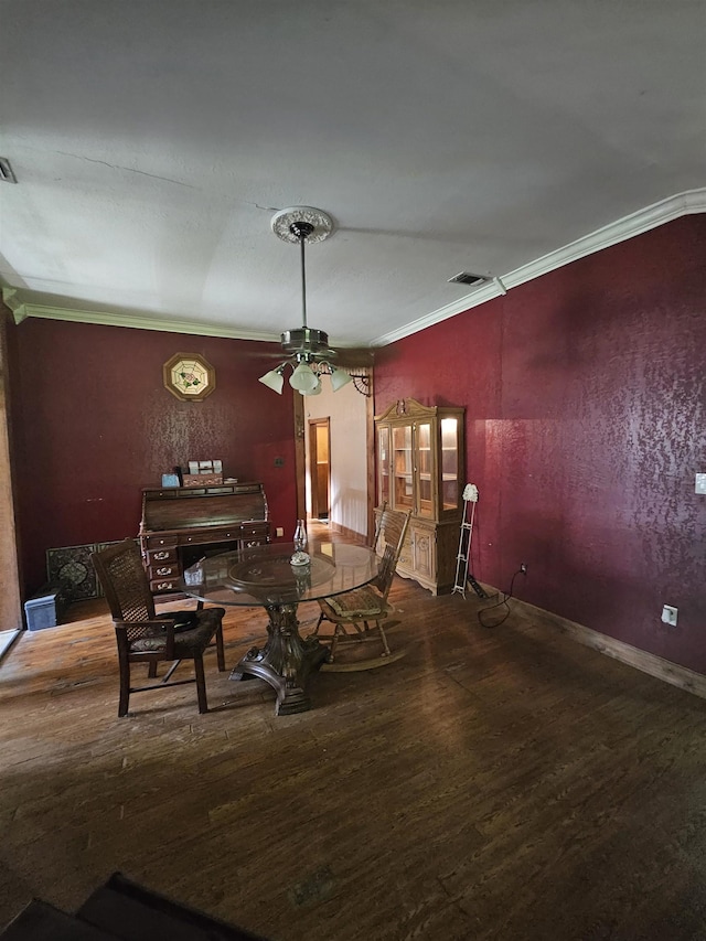 dining room featuring hardwood / wood-style flooring, ceiling fan, and ornamental molding