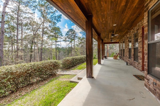 view of patio / terrace with ceiling fan and a porch