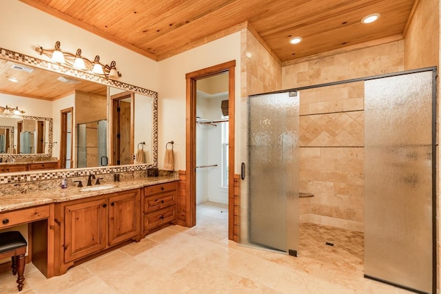 bathroom featuring ornamental molding, vanity, an enclosed shower, and wooden ceiling