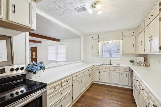 kitchen featuring electric stove, cream cabinets, sink, and dark hardwood / wood-style floors