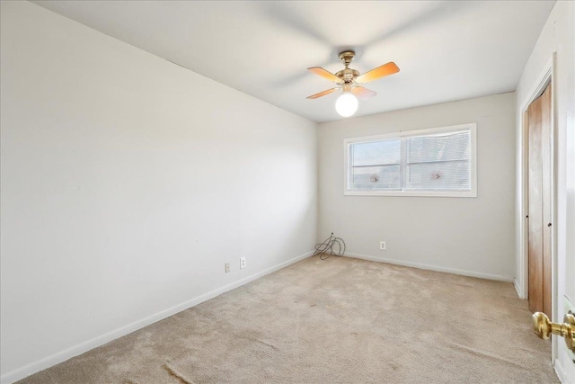 unfurnished bedroom with light carpet, a closet, and ceiling fan