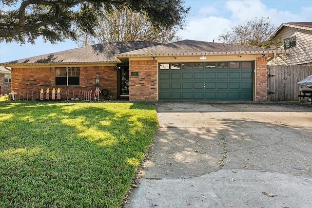 ranch-style home with a garage and a front lawn