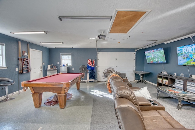 rec room featuring a textured ceiling and pool table