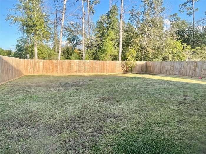301 Long Leaf St, Silsbee, TX 77656 - view of yard featuring a fenced backyard