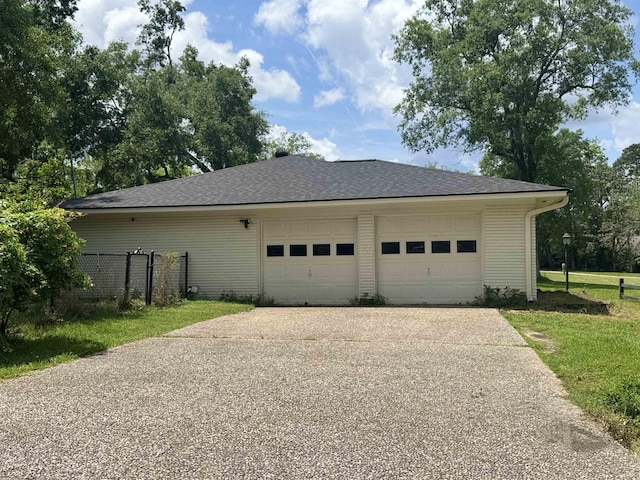 garage with fence