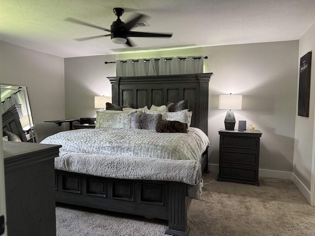 bedroom with baseboards, a ceiling fan, and light colored carpet