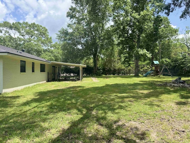 view of yard with a playground