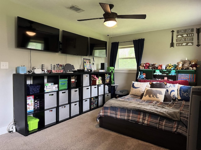 bedroom featuring visible vents, a ceiling fan, and carpet floors
