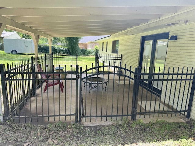 view of gate featuring fence