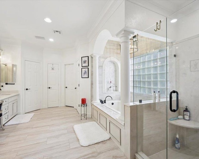 2700 Spurlock Rd, Nederland, TX 77627 - bathroom with decorative columns, a bath, vanity, a shower stall, and ornamental molding