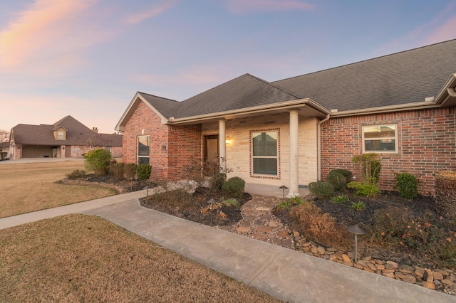 ranch-style house featuring a yard