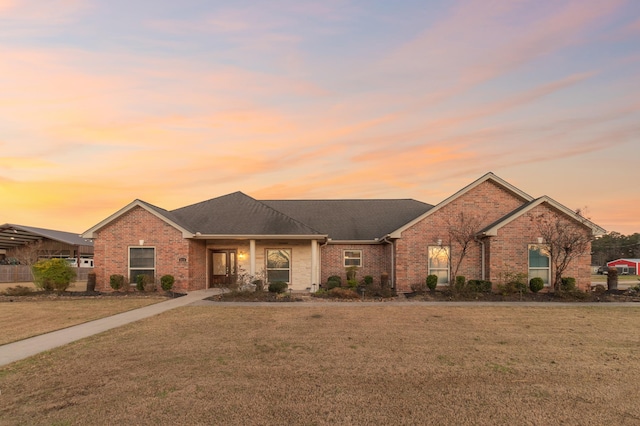 ranch-style house with a lawn