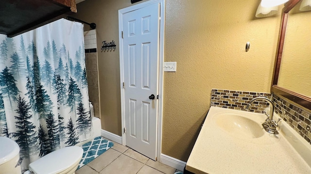 full bathroom with backsplash, tile patterned floors, toilet, vanity, and shower / tub combo