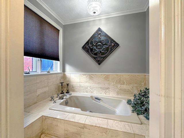 bathroom with a relaxing tiled tub, ornamental molding, and a textured ceiling