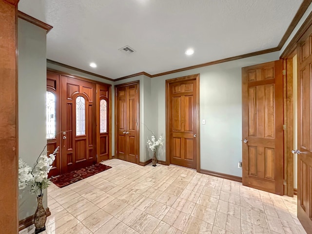 foyer entrance featuring ornamental molding