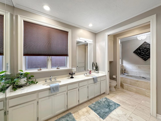 bathroom with a relaxing tiled tub, a textured ceiling, toilet, vanity, and ornamental molding