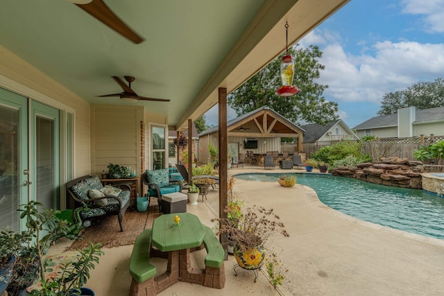 view of pool featuring a fenced in pool, a patio area, fence, an outdoor structure, and an outdoor living space