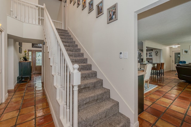 stairway featuring baseboards