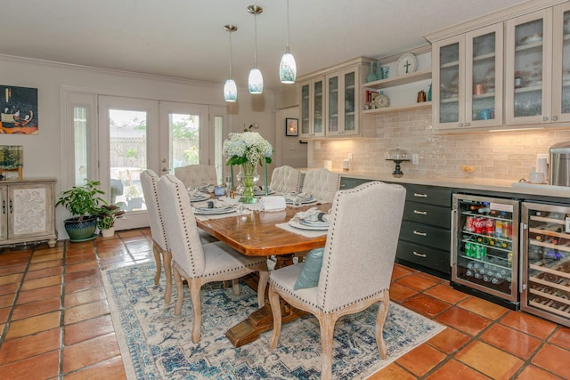 dining area featuring wine cooler, french doors, and crown molding