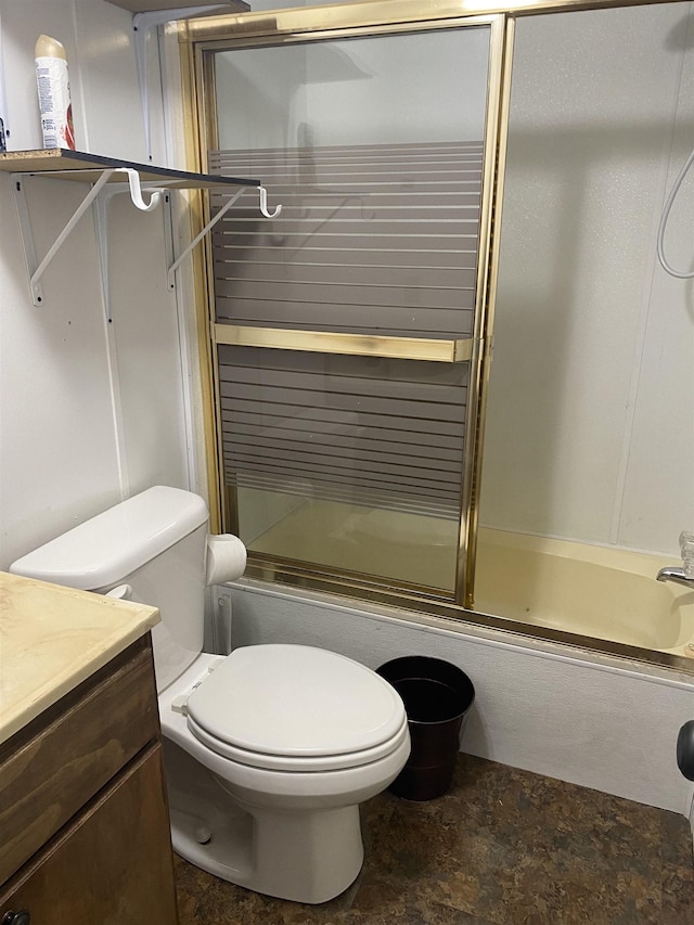 full bath with enclosed tub / shower combo, vanity, and toilet