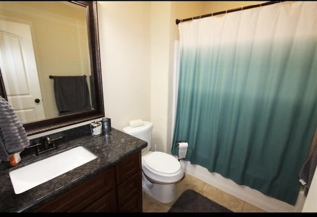 full bathroom featuring tile patterned flooring, vanity, shower / tub combo, and toilet