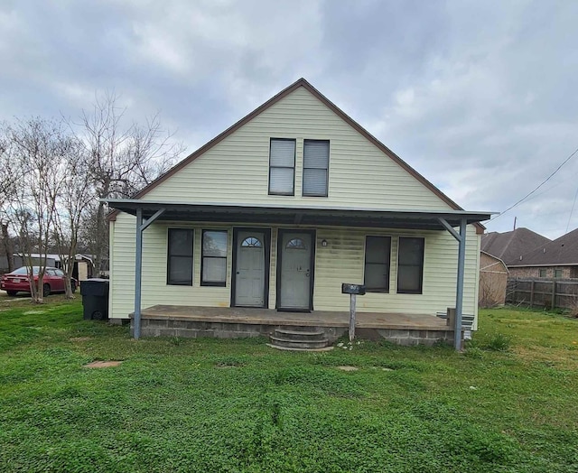 bungalow-style house with a front lawn and covered porch