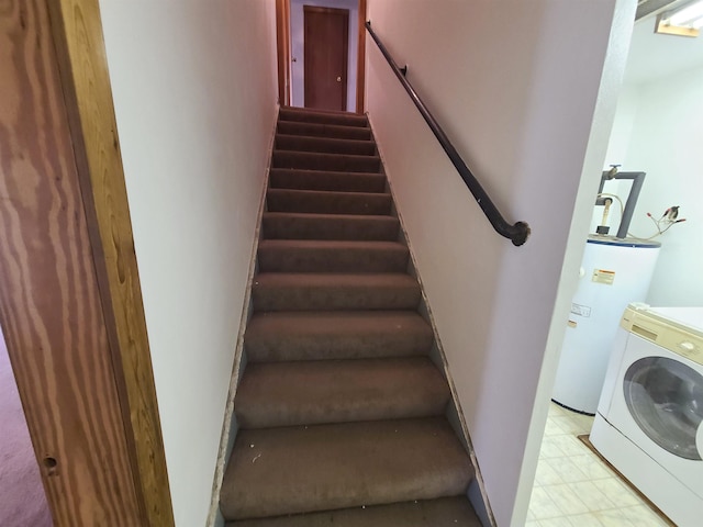 stairs with washer / clothes dryer and gas water heater