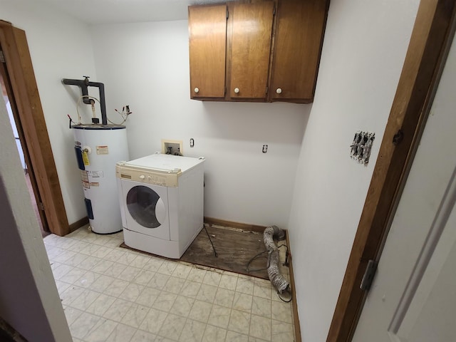 washroom with cabinets, washer / clothes dryer, and water heater