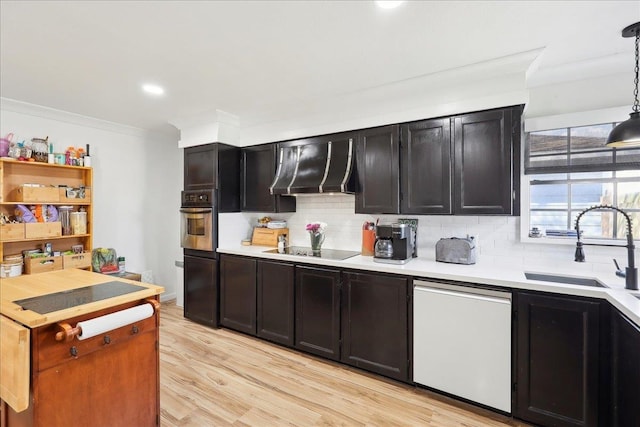 kitchen with extractor fan, white dishwasher, oven, black electric cooktop, and a sink