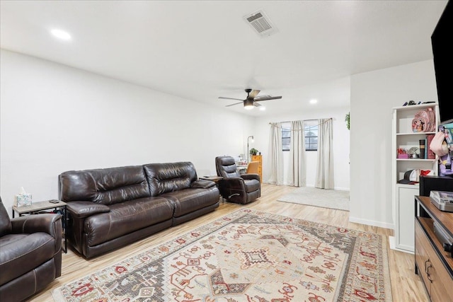 living room with recessed lighting, visible vents, ceiling fan, and light wood finished floors