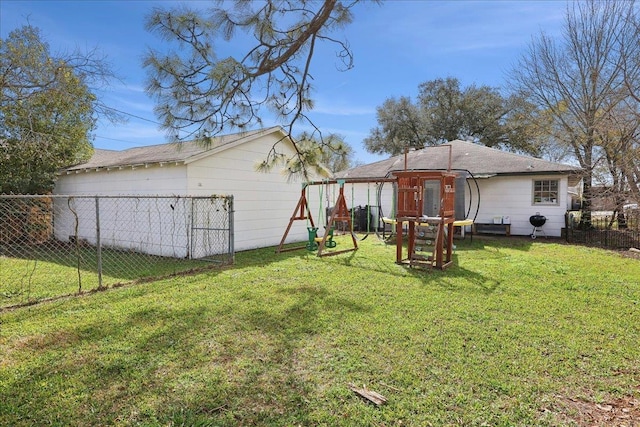 view of yard featuring fence and a playground