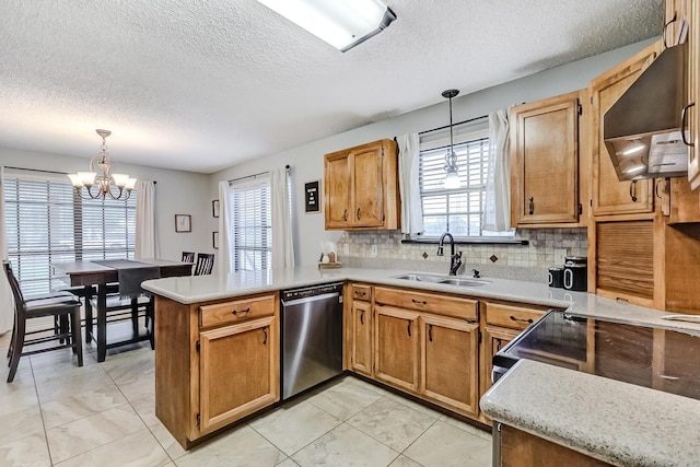 kitchen featuring dishwasher, an inviting chandelier, kitchen peninsula, pendant lighting, and decorative backsplash