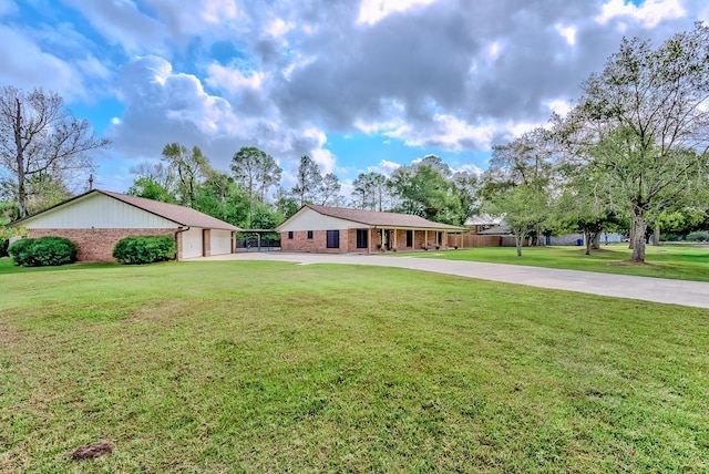 single story home featuring a front yard and a garage