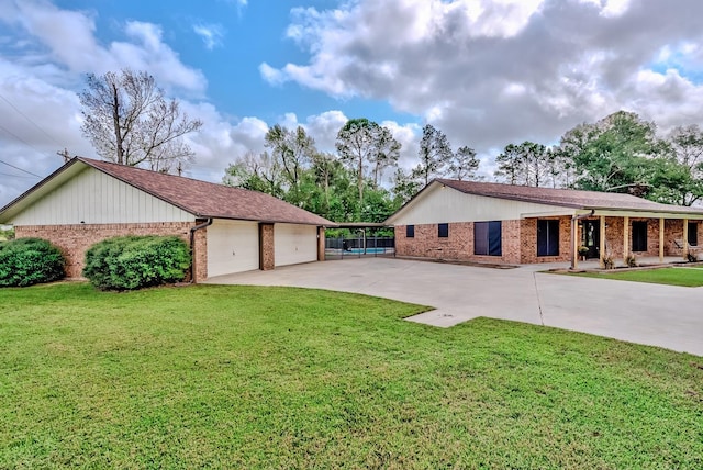 ranch-style home featuring a garage and a front lawn