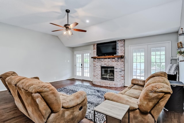 living room with a fireplace, ceiling fan, french doors, and a healthy amount of sunlight